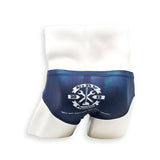 Men’s navy plumbing graphic swim brief – Basic back view with bold plumbing logo and full rear coverage