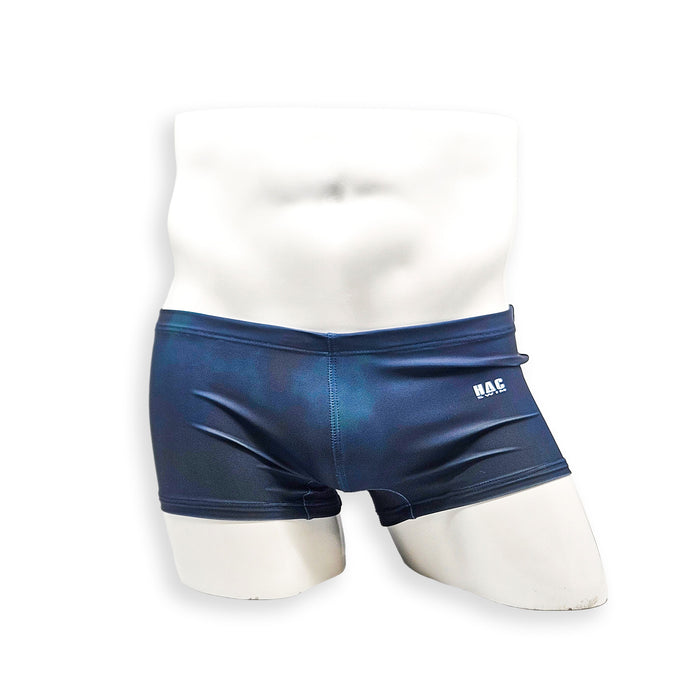 Men’s navy plumbing graphic swim trunk – Box Cut front view showing low-rise trunk fit and drawcord waist