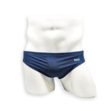 Men’s navy plumbing graphic swim brief – Flat Front front view showing flat front construction and clean lines