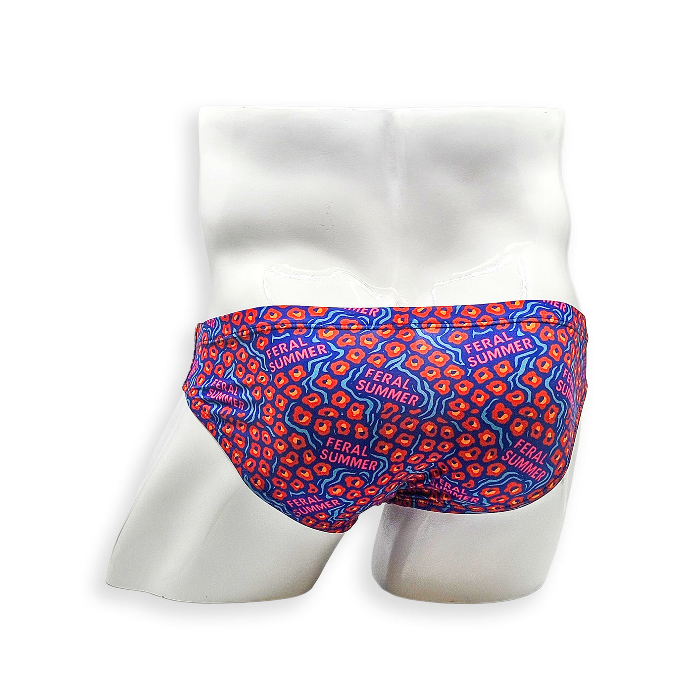 Rear view of men’s HAC Swim Feral Summer Flat Front swim brief featuring full print coverage in electric blue, hot pink and orange abstract pattern.