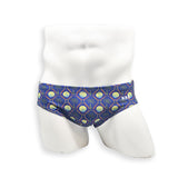Men’s palm and shell print swim brief – Basic cut front view showing contoured pouch and tropical geometric pattern