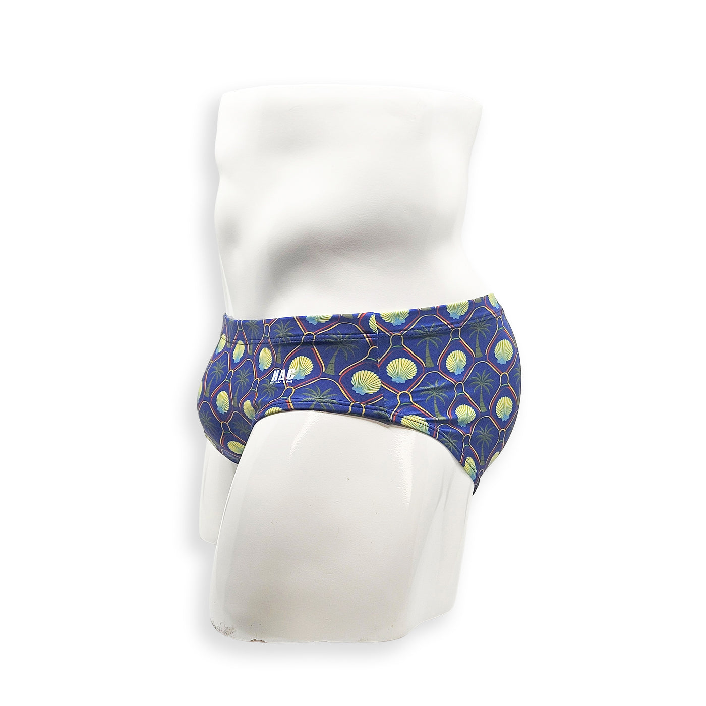 Men’s palm and shell print swim brief – Basic cut side view showing low-rise fit and printed waistband detail